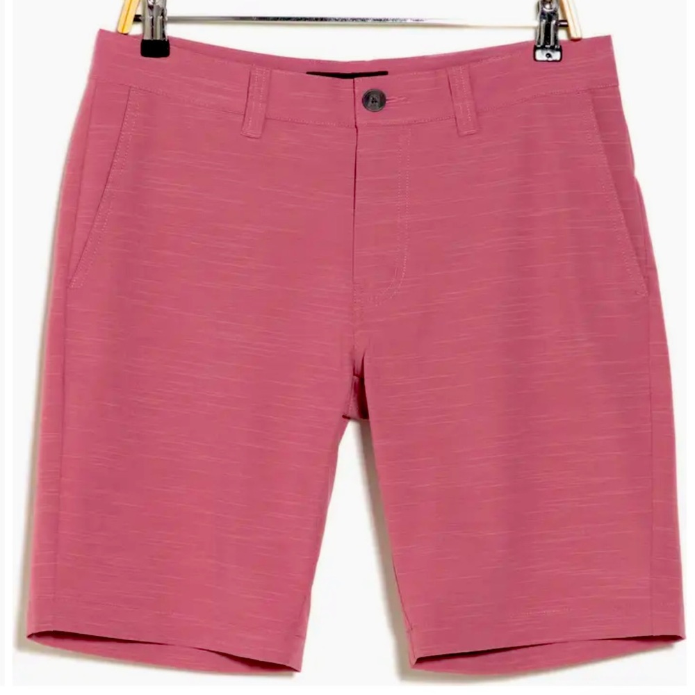 Travis Mathew on a boat shorts